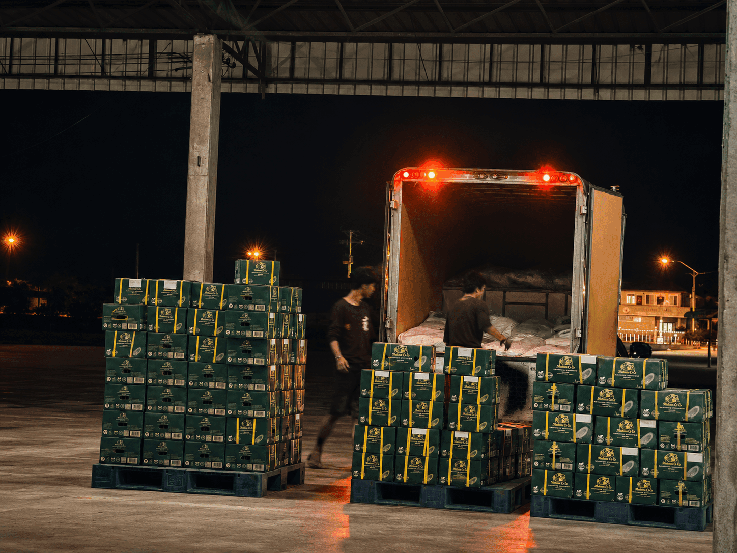 Madame CoCo coconut water cartons in palletized loading context